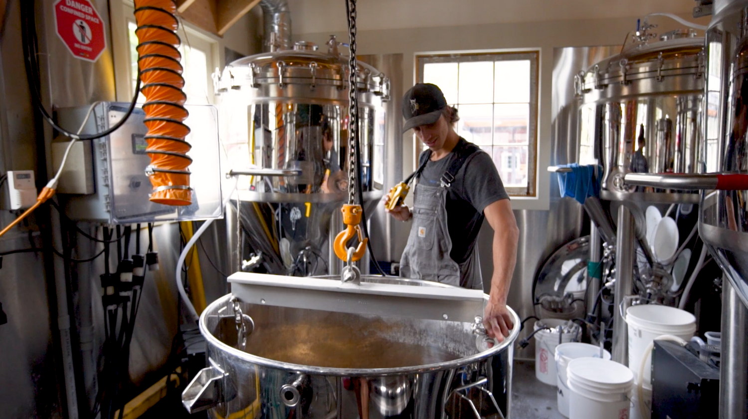 micro brewing in mash tun at Barn Owl brewery Kelowna Canada