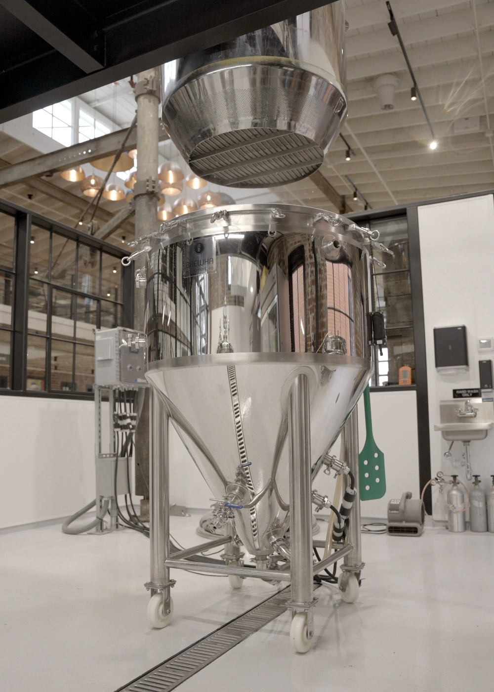 Large fermenter tank in a modern indoor setting