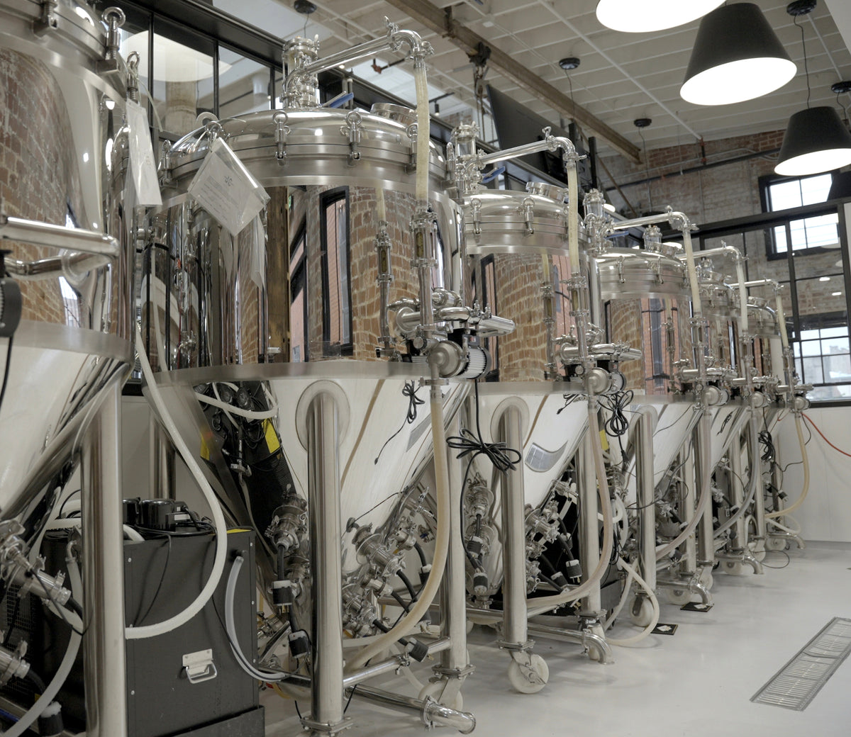 Brewer working with a BREWHA commercial brewing system